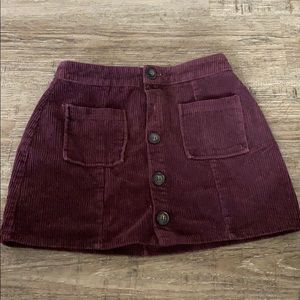 a burgundy skirt
